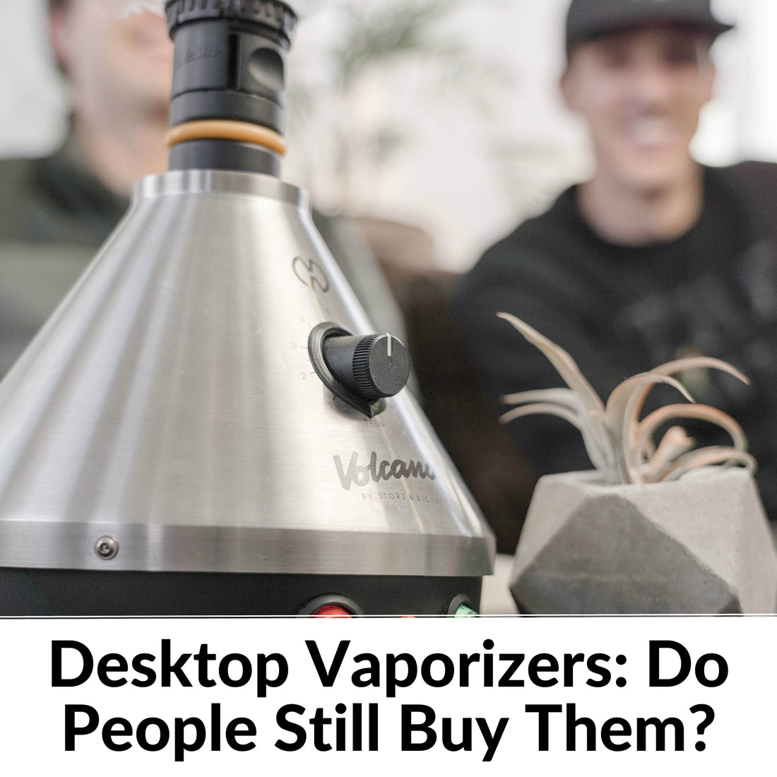 silver desktop vaporizer with man in the background