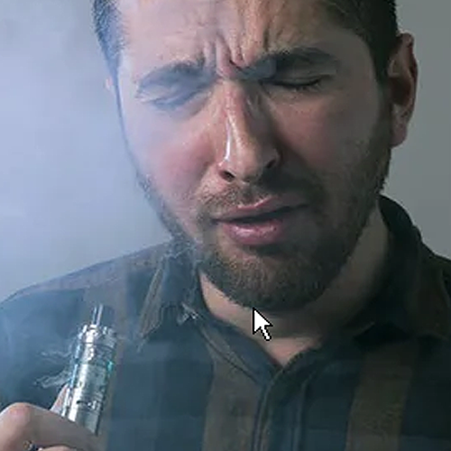 Man vaping and coughing