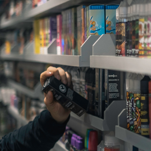 Man picking up vape from vapestore