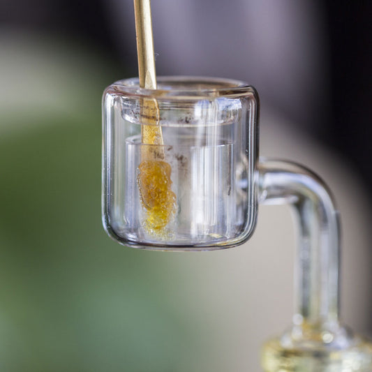 Dab nail with dab tool applying wax