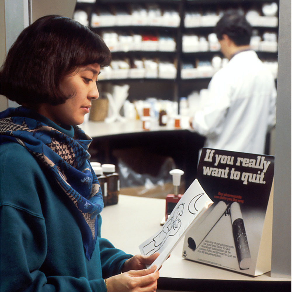 Woman looking at a paper in a dispensary