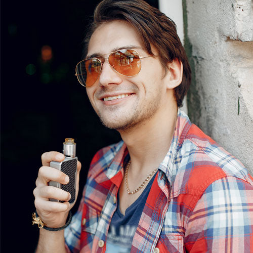 Man vaping and smiling