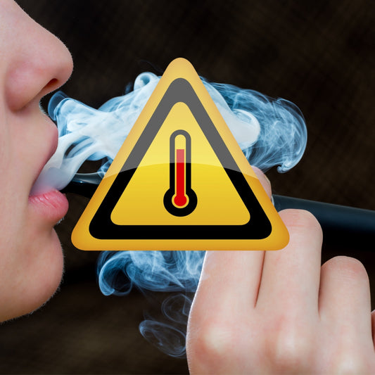 Person smoking vape with caution sign 