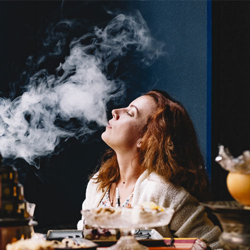 woman smoking in a restaurant