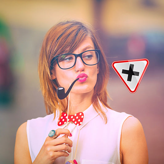 Woman with glasses smoking a sherlock pipe